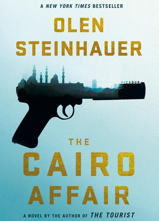 Book cover of The Cairo Affair by Olen Steinhauer featuring large gold typography on a pale blue background, a black handgun silhouette filled with a city skyline resembling Cairo, and text indicating “A New York Times Bestseller” and “A novel by the author of The Tourist.”