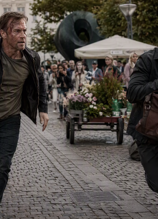 Hyper-realistic cinematic chase scene in Copenhagen, Denmark,  from The Templar Legacy by Steve Berry showing a former intelligence operative pursuing a suspect carrying a leather bag through a crowded cobblestone pedestrian square. Danish architecture, outdoor café seating, bicycles, flower carts, a modern art sculpture, and blurred pedestrians create a high-tension espionage thriller atmosphere in natural daylight.