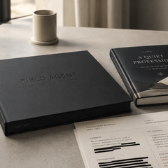 Field Agent Monthly Intelligence Brief subscription box with espionage hardcover novel and redacted intelligence briefing document, Unit 3877
