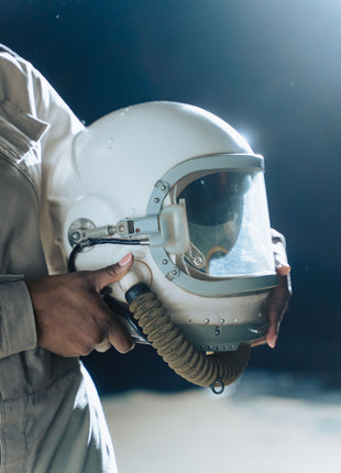 Astronaut helmet representing space theme and imagination in Wonder by R J Palacio